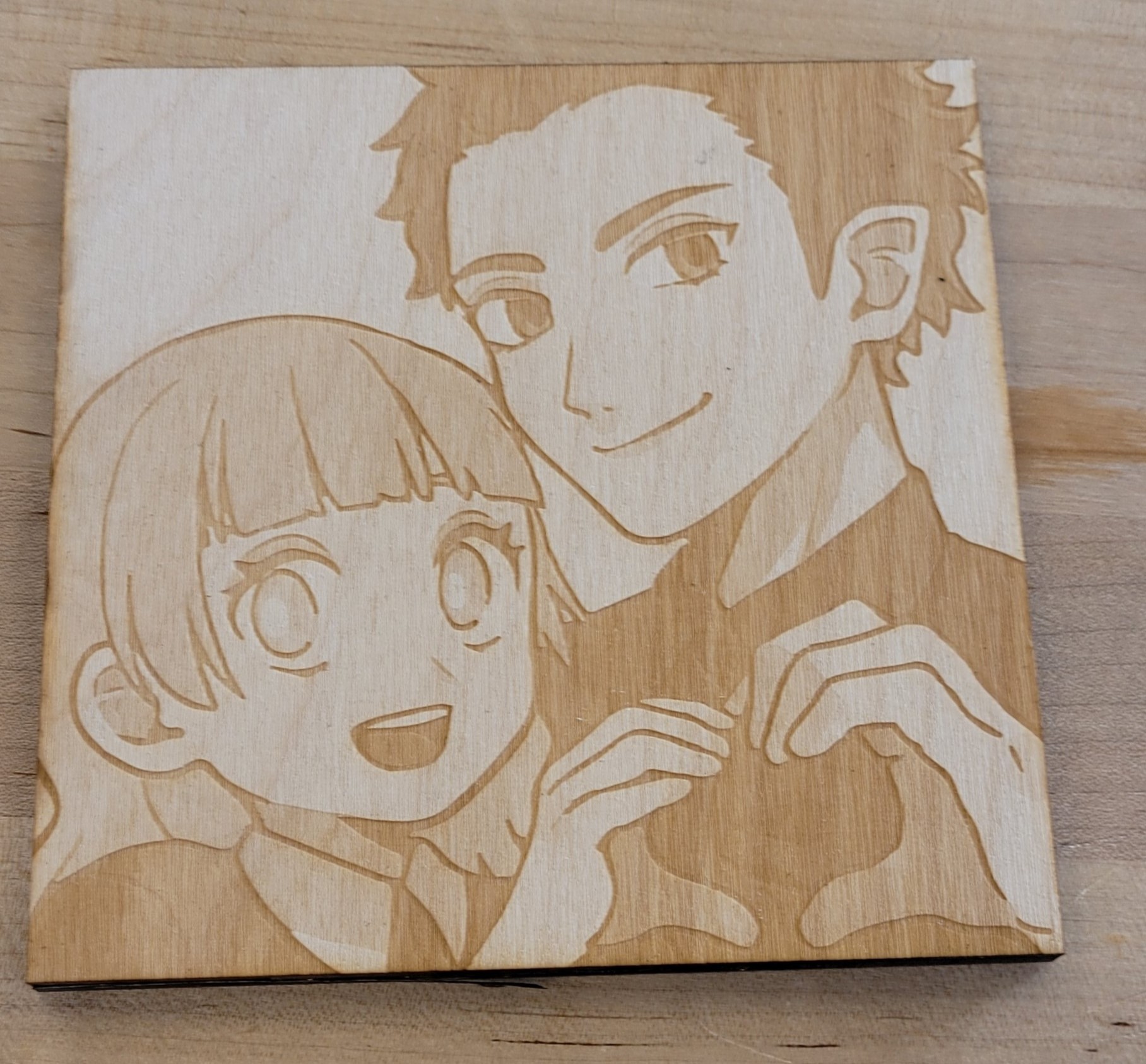 A wooden laser portrait of my friend and I