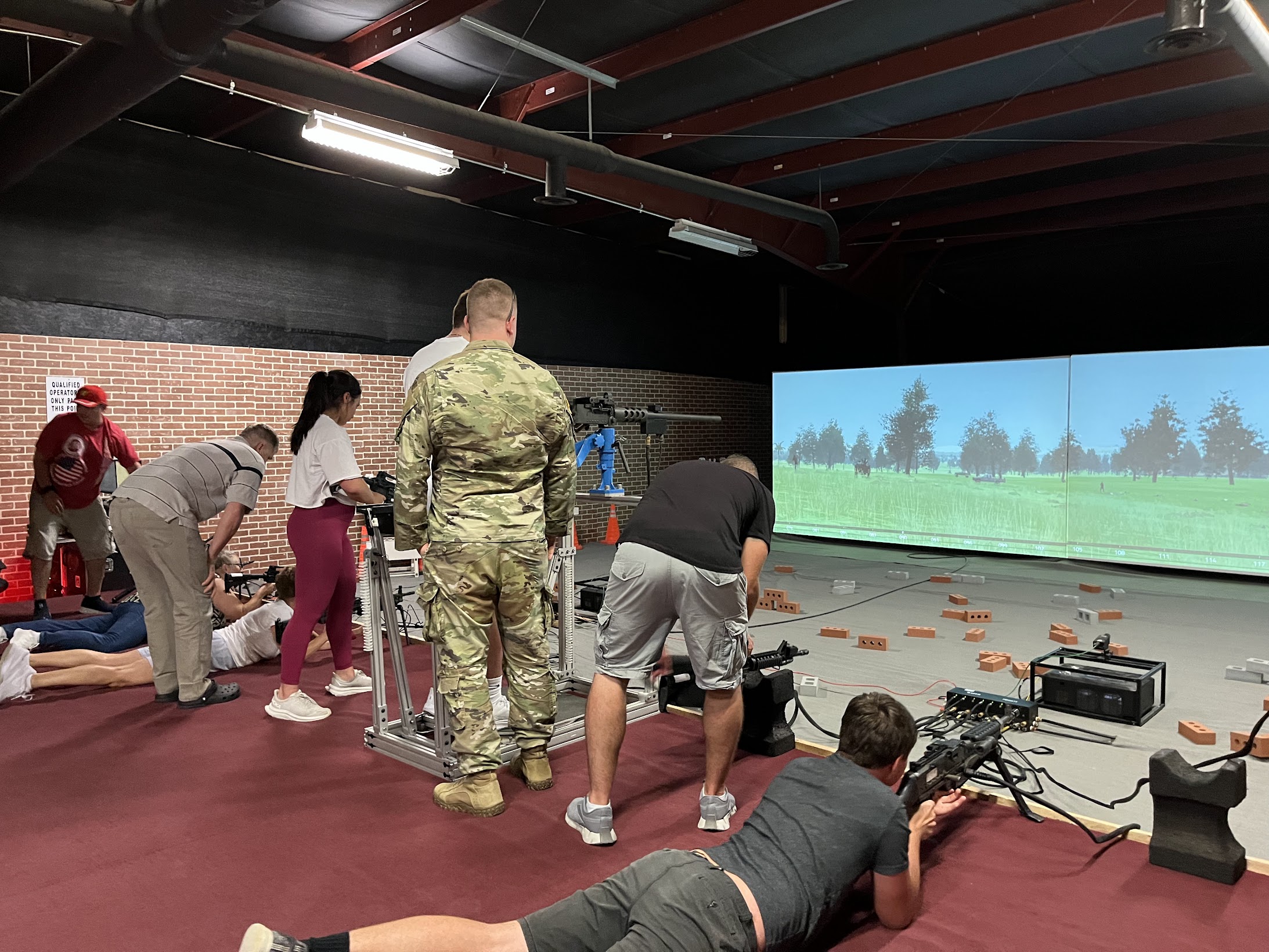 The team at a virtual gun range